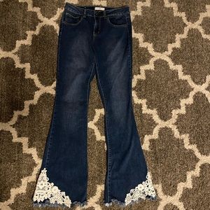 Altar’d State flare leg jeans with lace detail